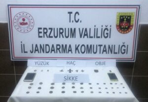 - Zanlılardan 36 sikke, 4 haç motifli kolye ucu, 3