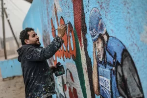İDLİB (AA) – Suriyeli grafiti sanatçısı Aziz Esmer, İsrail'in Gazze'ye